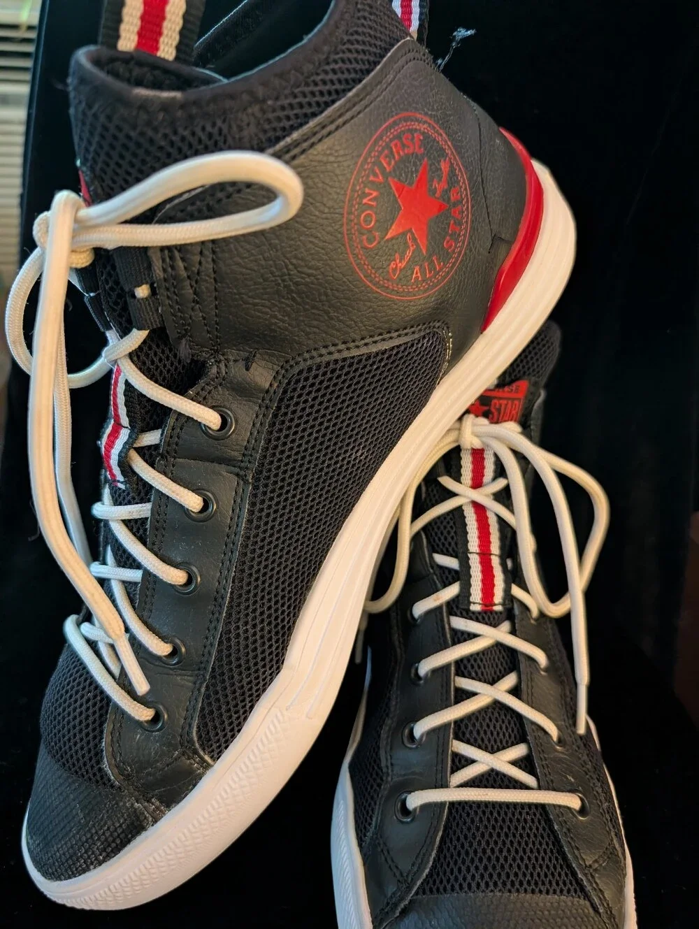 Converse Men’s Black High-Top Sneakers with White Laces and Red Stripe